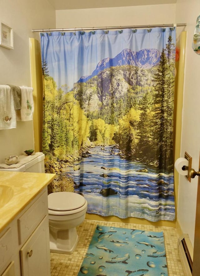 full bath featuring toilet, a baseboard radiator, tile patterned flooring, and vanity