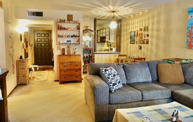 living area featuring carpet and visible vents