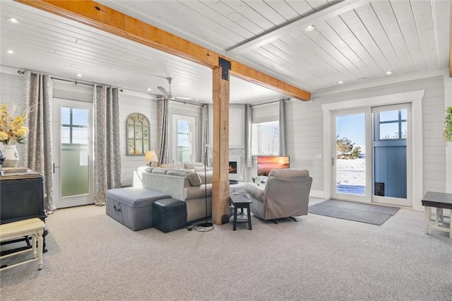 living room with wooden ceiling, recessed lighting, beam ceiling, and light colored carpet