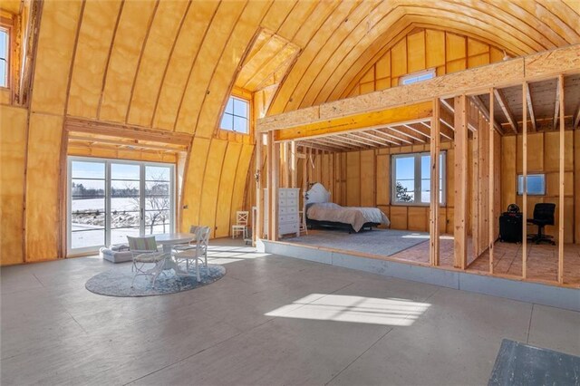 unfurnished bedroom featuring high vaulted ceiling