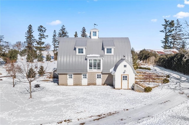 view of snow covered house