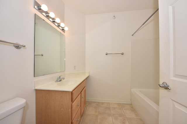 full bathroom featuring tile patterned flooring, baseboards, vanity, and toilet