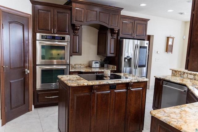 7926 S County Rd A, Superior, WI 54880 - kitchen with stainless steel appliances, light tile patterned floors, dark brown cabinets, a kitchen island, and recessed lighting