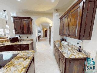 7926 S County Rd A, Superior, WI 54880 - bar featuring arched walkways, decorative light fixtures, and light tile patterned floors