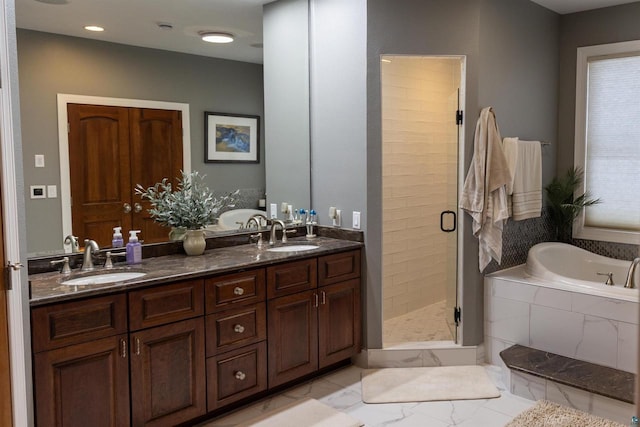 7926 S County Rd A, Superior, WI 54880 - full bath featuring a stall shower, a bath, double vanity, marble finish flooring, and recessed lighting