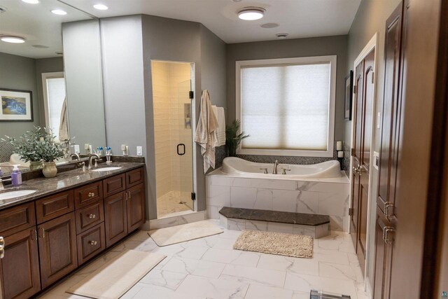 7926 S County Rd A, Superior, WI 54880 - bathroom featuring a garden tub, double vanity, marble finish flooring, and a shower stall