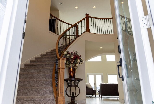 7926 S County Rd A, Superior, WI 54880 - stairs with a towering ceiling, recessed lighting, and french doors