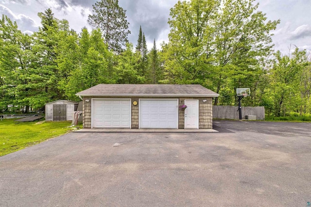 7926 S County Rd A, Superior, WI 54880 - detached garage featuring a storage unit