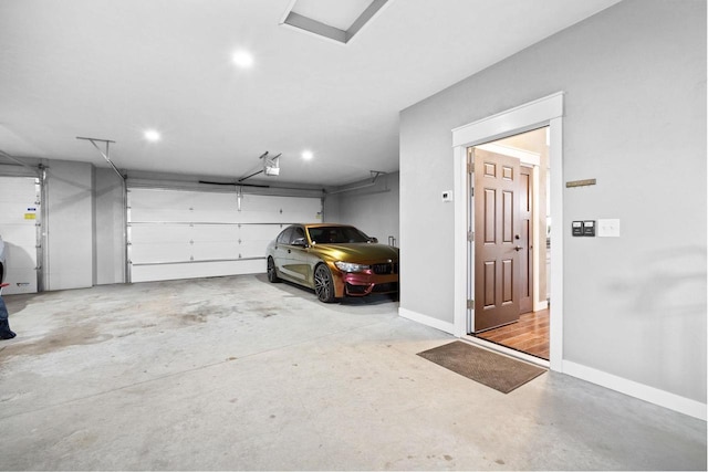 parking deck with baseboards and a garage door opener