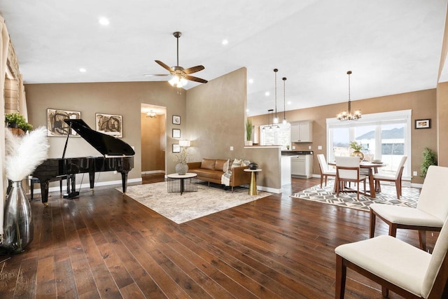 living area with baseboards, vaulted ceiling, dark wood-style flooring, and ceiling fan with notable chandelier