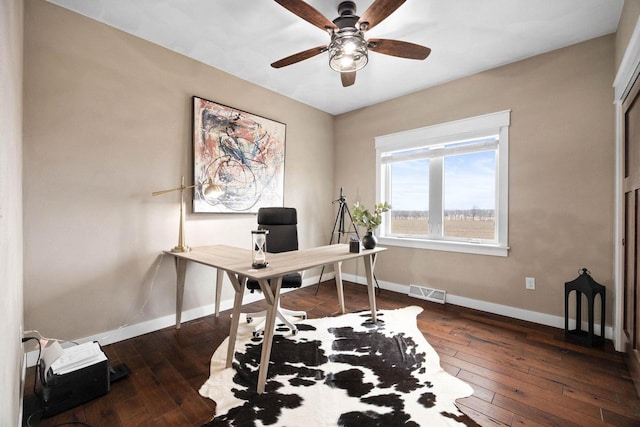 office with ceiling fan, hardwood / wood-style floors, visible vents, and baseboards