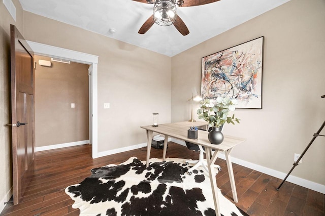 office area featuring a ceiling fan, baseboards, and wood finished floors