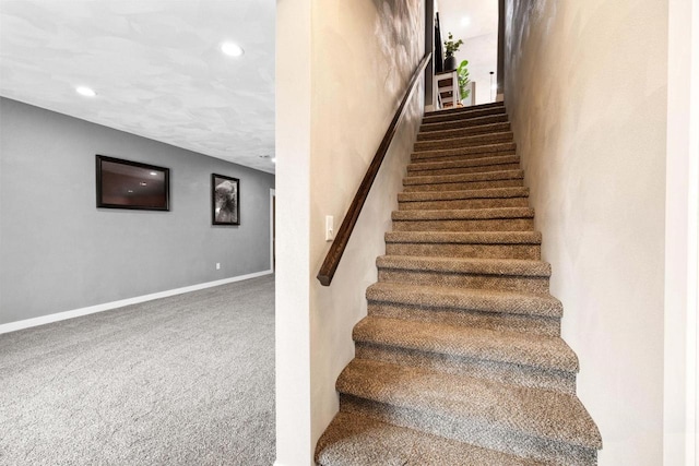 stairway with baseboards, carpet flooring, and recessed lighting