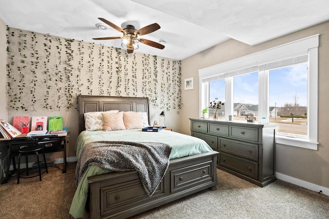 bedroom with baseboards, a ceiling fan, and light colored carpet