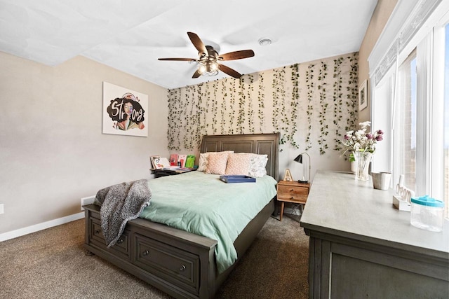 bedroom with visible vents, baseboards, dark colored carpet, and a ceiling fan