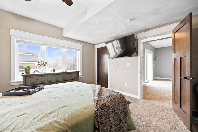 bedroom with carpet and baseboards