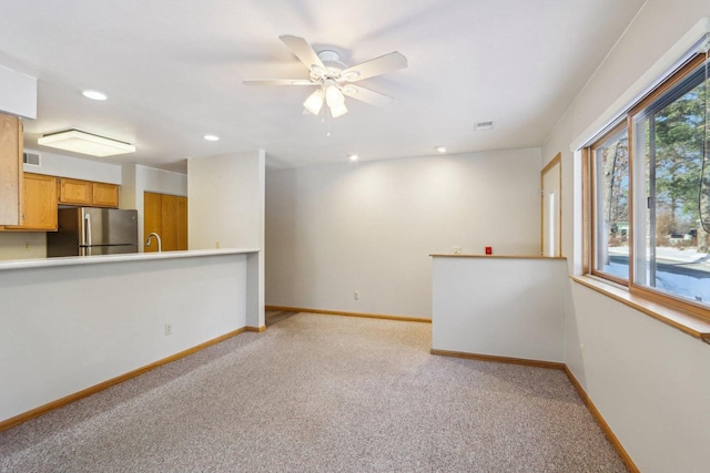 interior space with recessed lighting, visible vents, baseboards, and light colored carpet