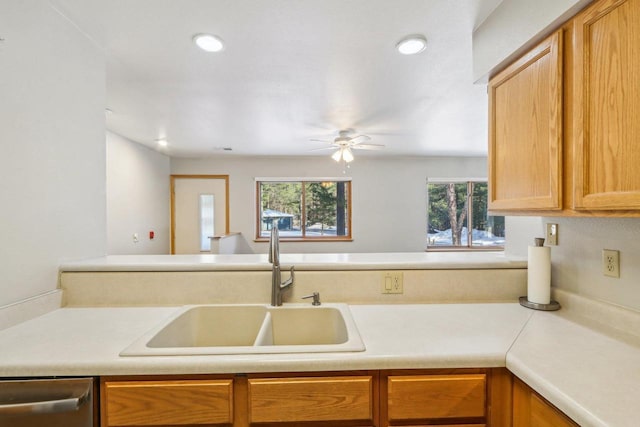 kitchen with recessed lighting, a sink, a ceiling fan, light countertops, and stainless steel dishwasher