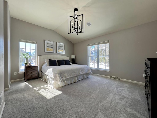 bedroom with a chandelier, light carpet, visible vents, baseboards, and vaulted ceiling