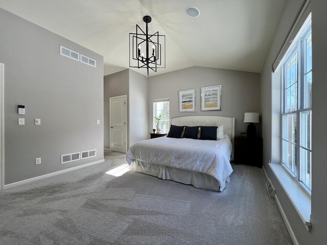 bedroom featuring lofted ceiling, baseboards, visible vents, and light colored carpet