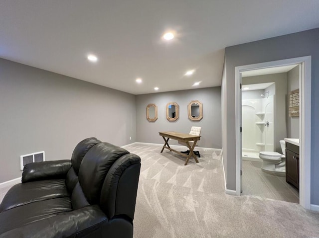 living room with recessed lighting, light carpet, visible vents, and baseboards