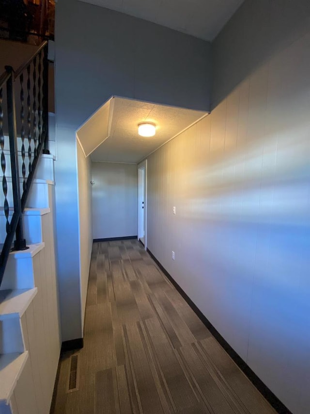 hallway featuring stairs and visible vents