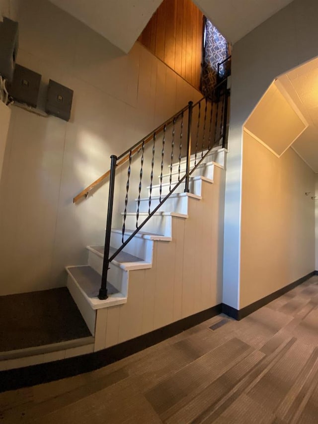 stairway featuring baseboards