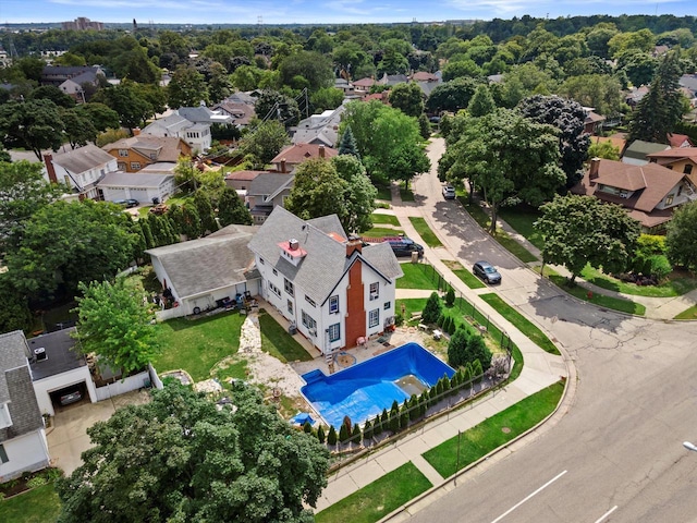 birds eye view of property with a residential view