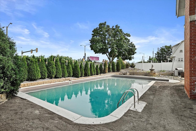 view of pool with fence and a fenced in pool