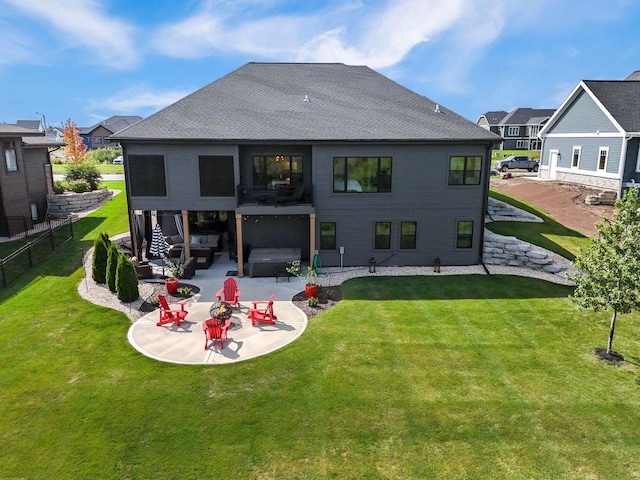 back of house with a yard, a residential view, a patio, and fence