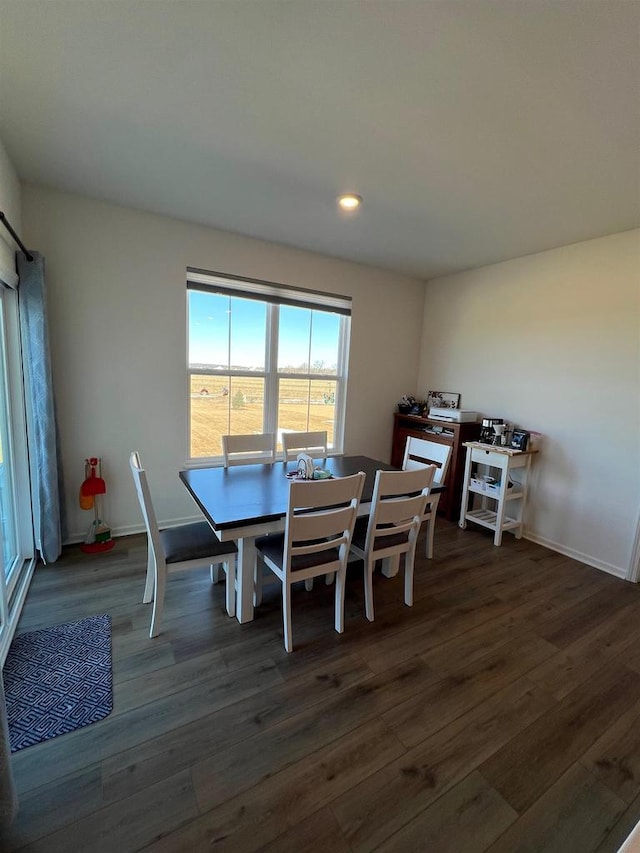 dining room with recessed lighting, wood finished floors, and baseboards