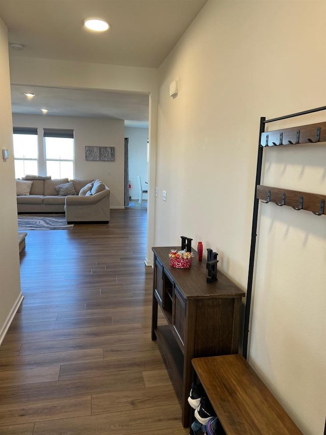 corridor with recessed lighting and dark wood finished floors