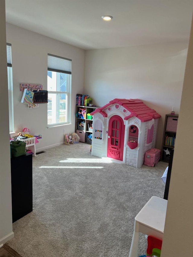 game room featuring carpet floors and baseboards