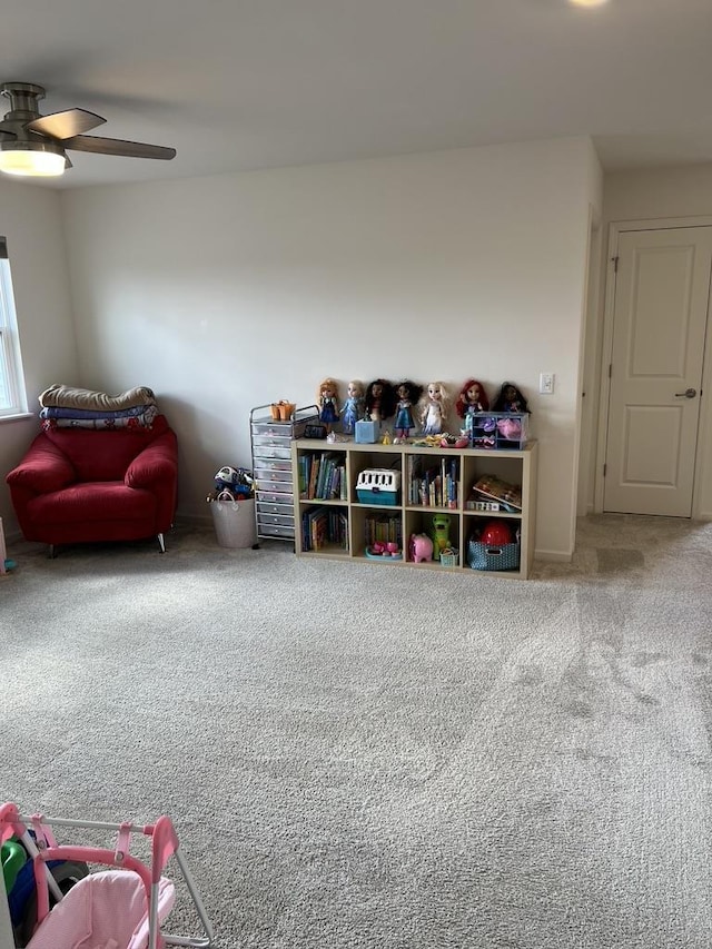 rec room featuring carpet and a ceiling fan