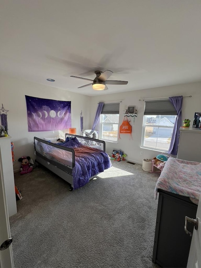 carpeted bedroom with ceiling fan