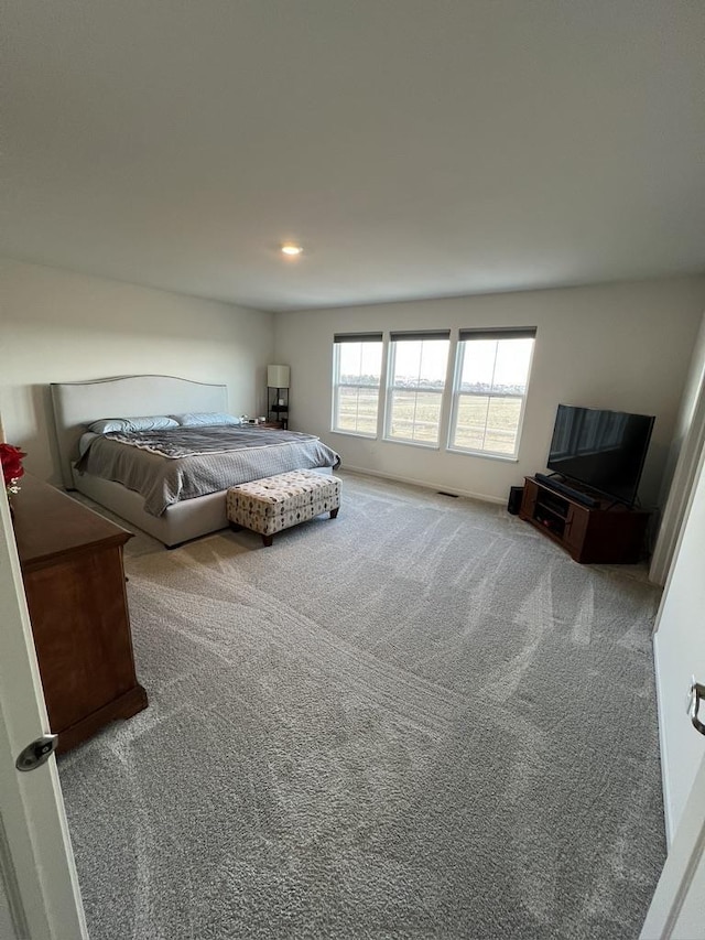 carpeted bedroom featuring recessed lighting