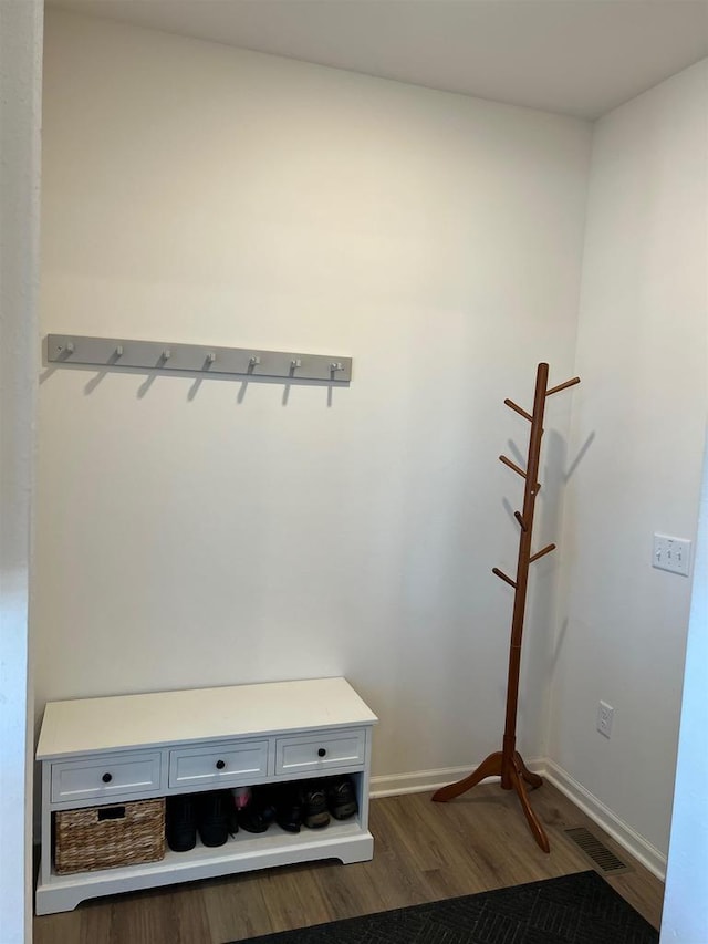 mudroom with visible vents, baseboards, and wood finished floors