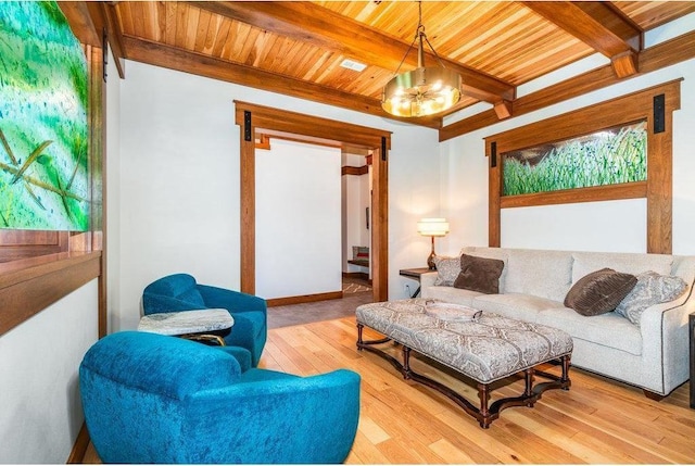 living area with a chandelier, light wood-style flooring, beamed ceiling, and wood ceiling