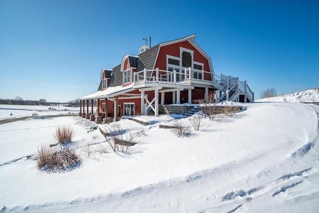 exterior space with a gambrel roof