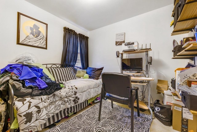 home office with lofted ceiling and light colored carpet