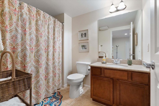 bathroom with baseboards, toilet, a shower with curtain, tile patterned floors, and vanity