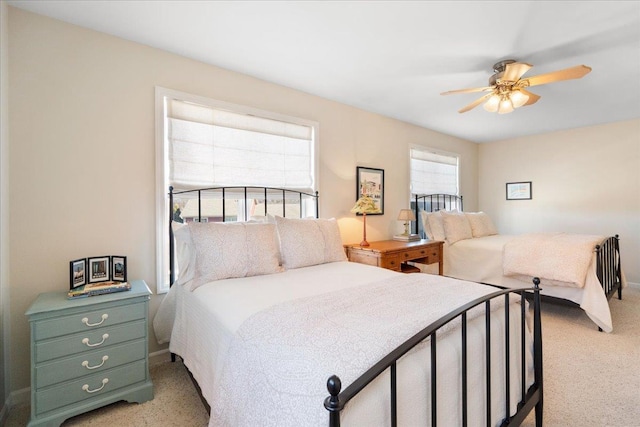 carpeted bedroom featuring a ceiling fan