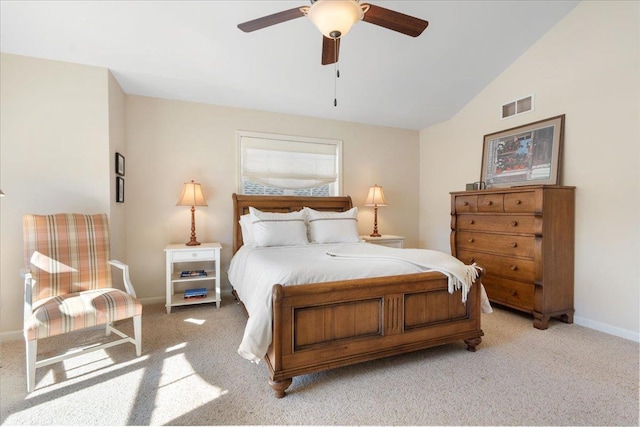 bedroom featuring light colored carpet, visible vents, vaulted ceiling, ceiling fan, and baseboards