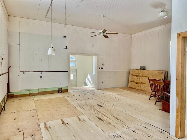 interior space featuring a ceiling fan