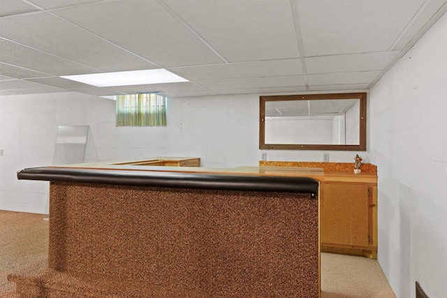 bar with concrete block wall and a dry bar