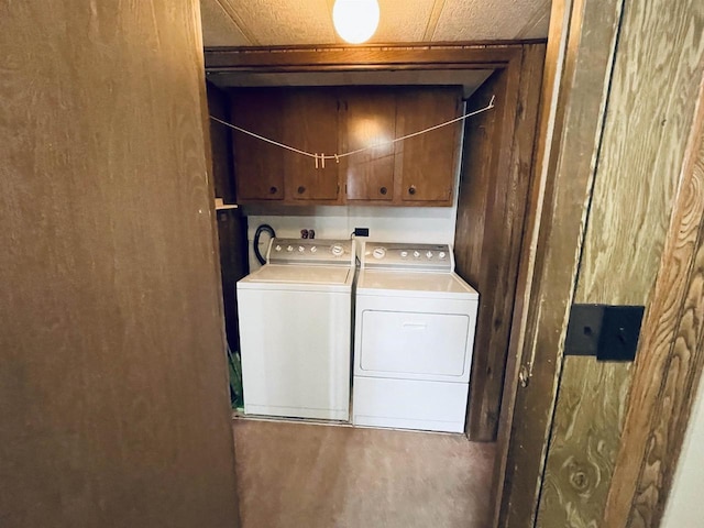 laundry room with cabinet space and washer and dryer