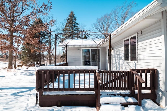 view of snow covered deck