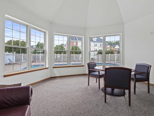 sunroom featuring lofted ceiling