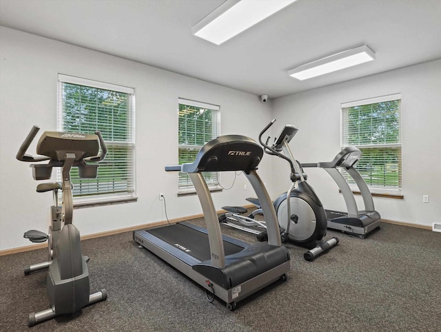 workout area featuring baseboards