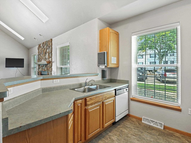 kitchen featuring a healthy amount of sunlight, visible vents, white dishwasher, and a sink